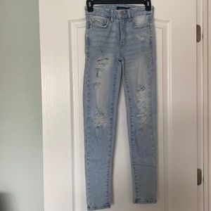 Light blue skinny jeans with rips